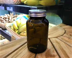Brown glass jar with metal lid